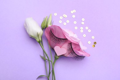 Photo of Flower with false eyelashes and pink paper heart as beautiful face on violet background, flat lay