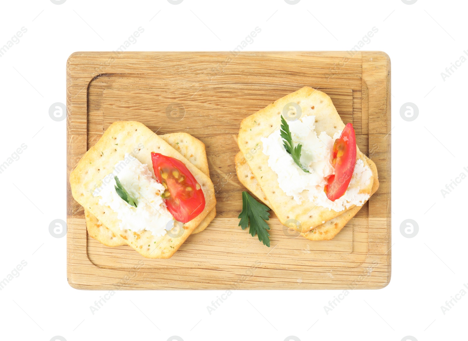 Photo of Delicious crackers with cream cheese, tomato and parsley on white background, top view