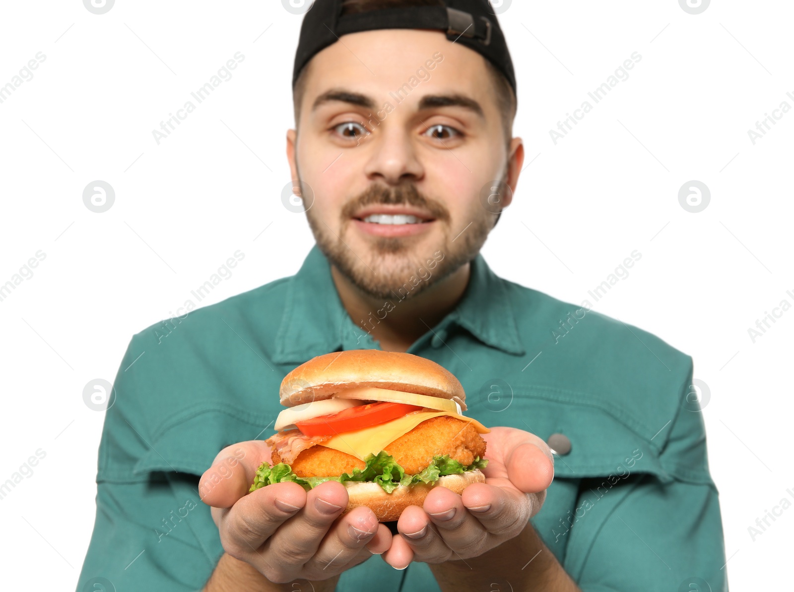 Photo of Handsome man with tasty burger isolated on white