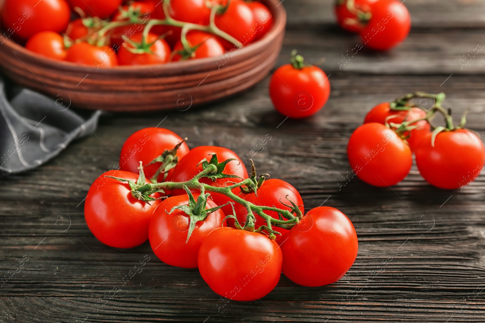 Photo of Fresh ripe red tomatoes on wooden table