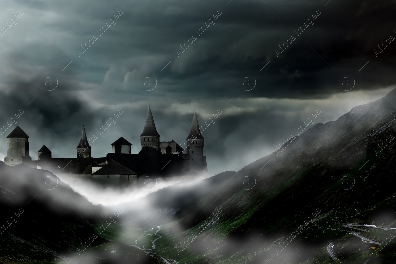 Image of Fantasy world. Mystical castle and mountains covering with fog in night