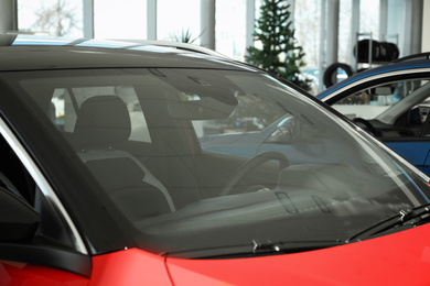 Photo of Modern car with tinting foil on window, closeup
