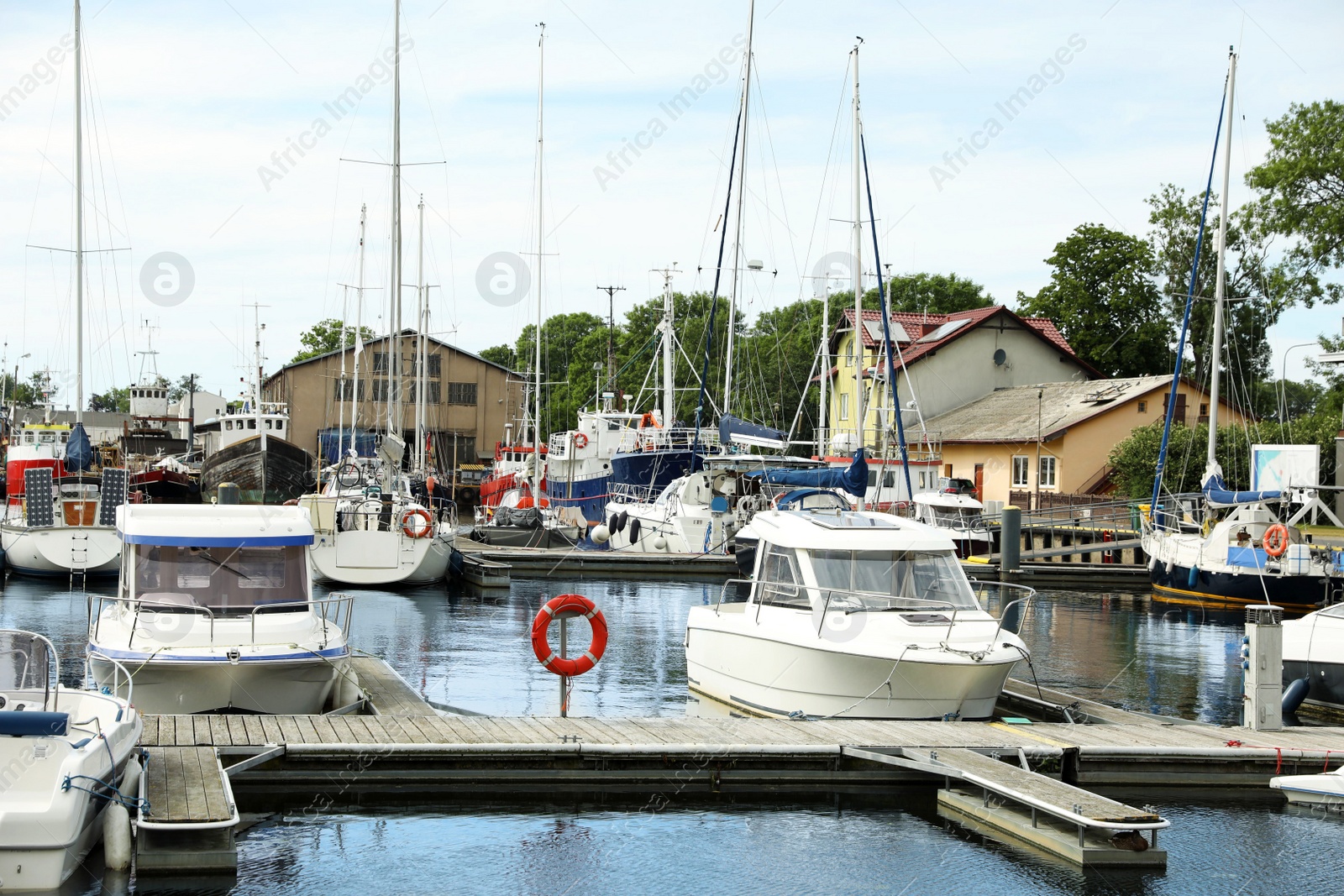 Photo of Beautiful view of city pier with modern boats