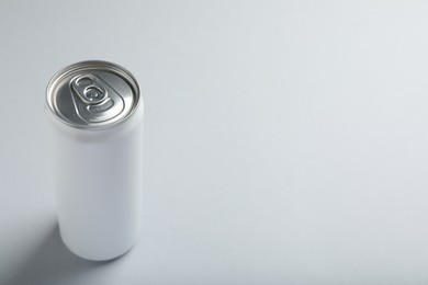 Photo of Can of energy drink on white background. Space for text