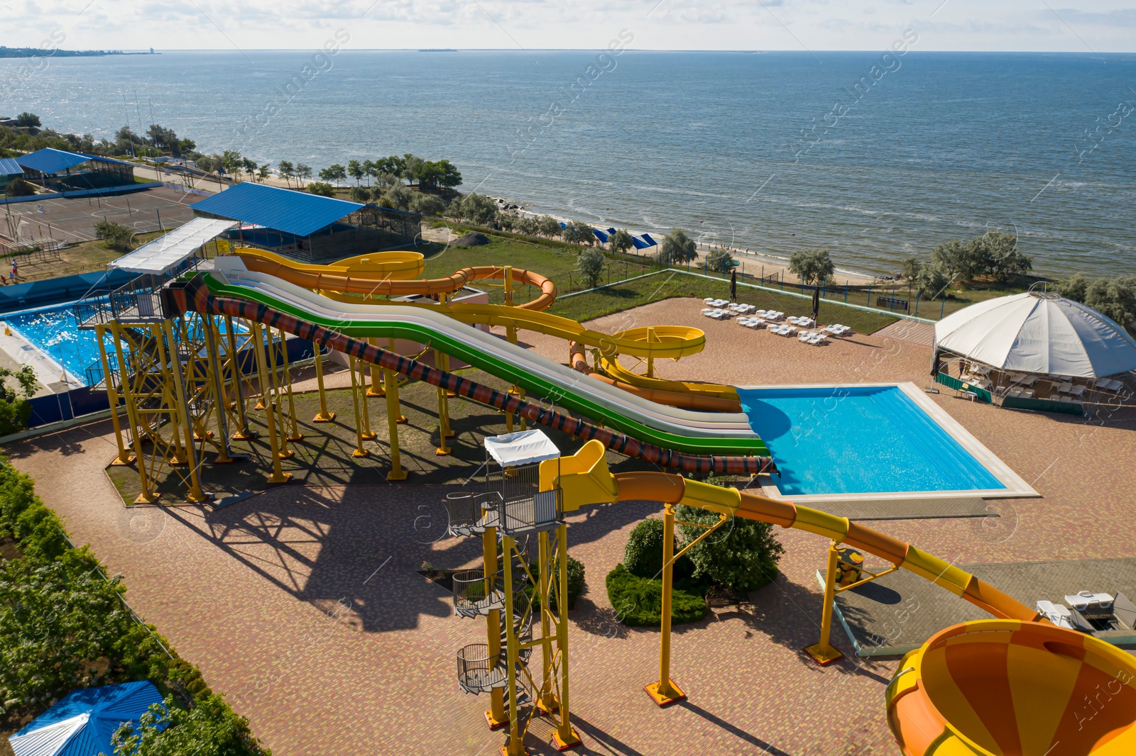 Image of Aerial view of water park on sunny day