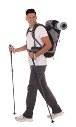 Male hiker with backpack and trekking poles on white background