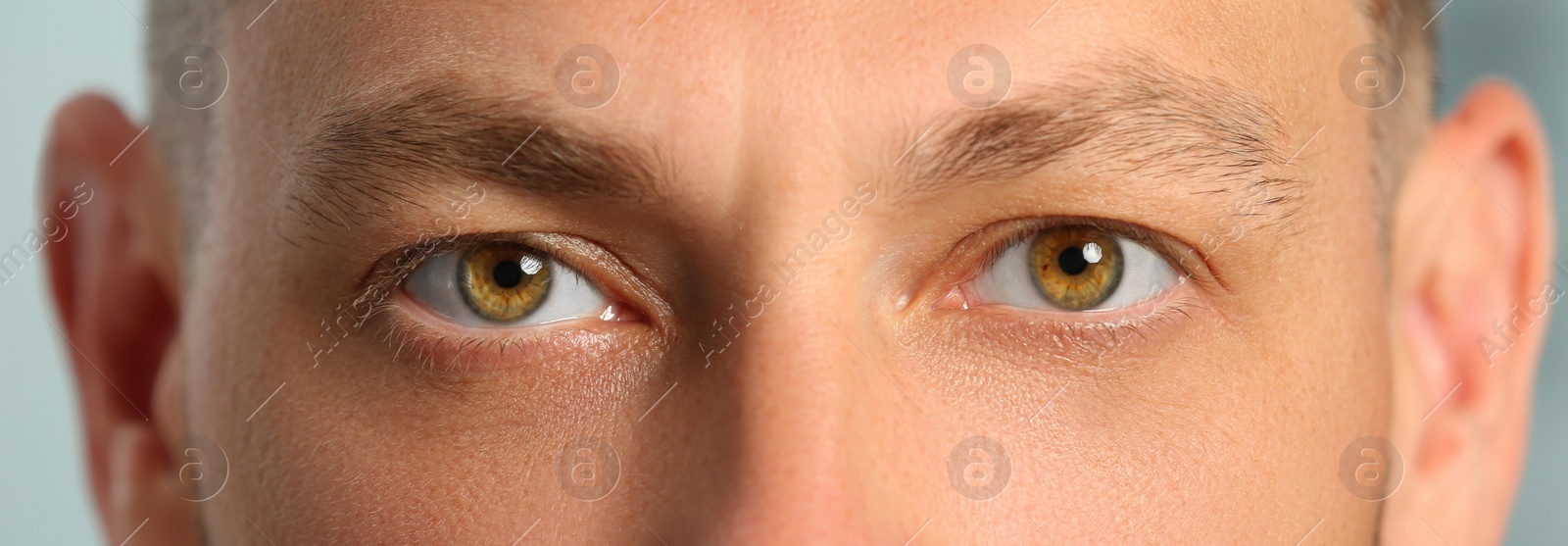 Image of Closeup view of man with beautiful eyes. Banner design