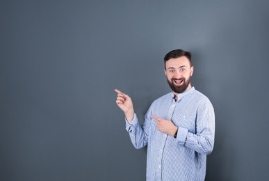 Portrait of handsome bearded man on color background