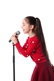 Photo of Little girl singing into microphone on white background