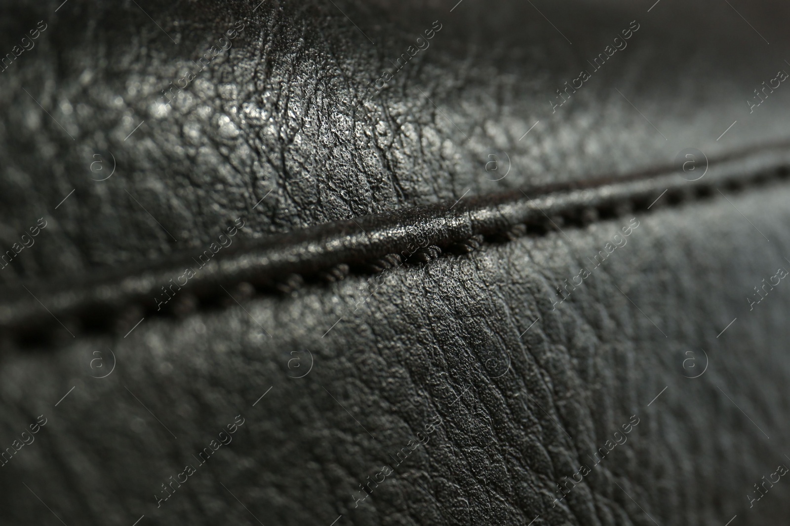 Photo of Texture of black leather as background, closeup