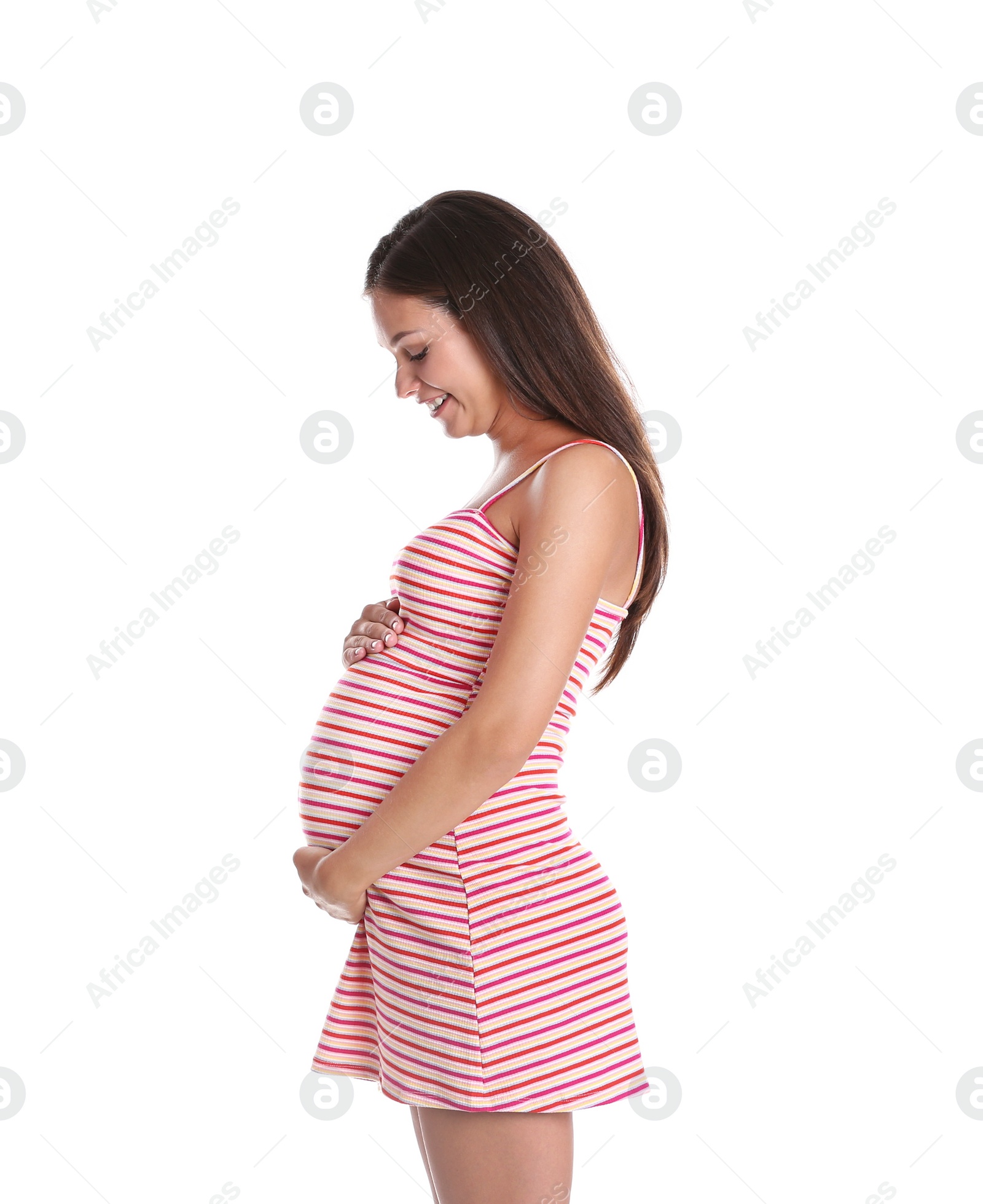 Photo of Happy pregnant woman posing on white background