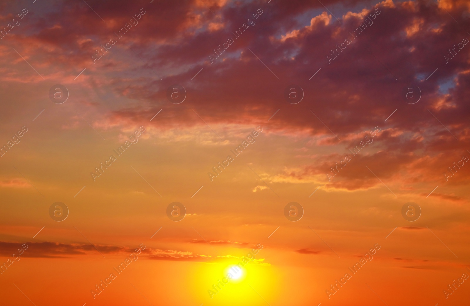 Image of Beautiful view of orange sky with clouds at sunset