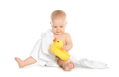 Photo of Cute little baby with soft towel and toy duck on white background