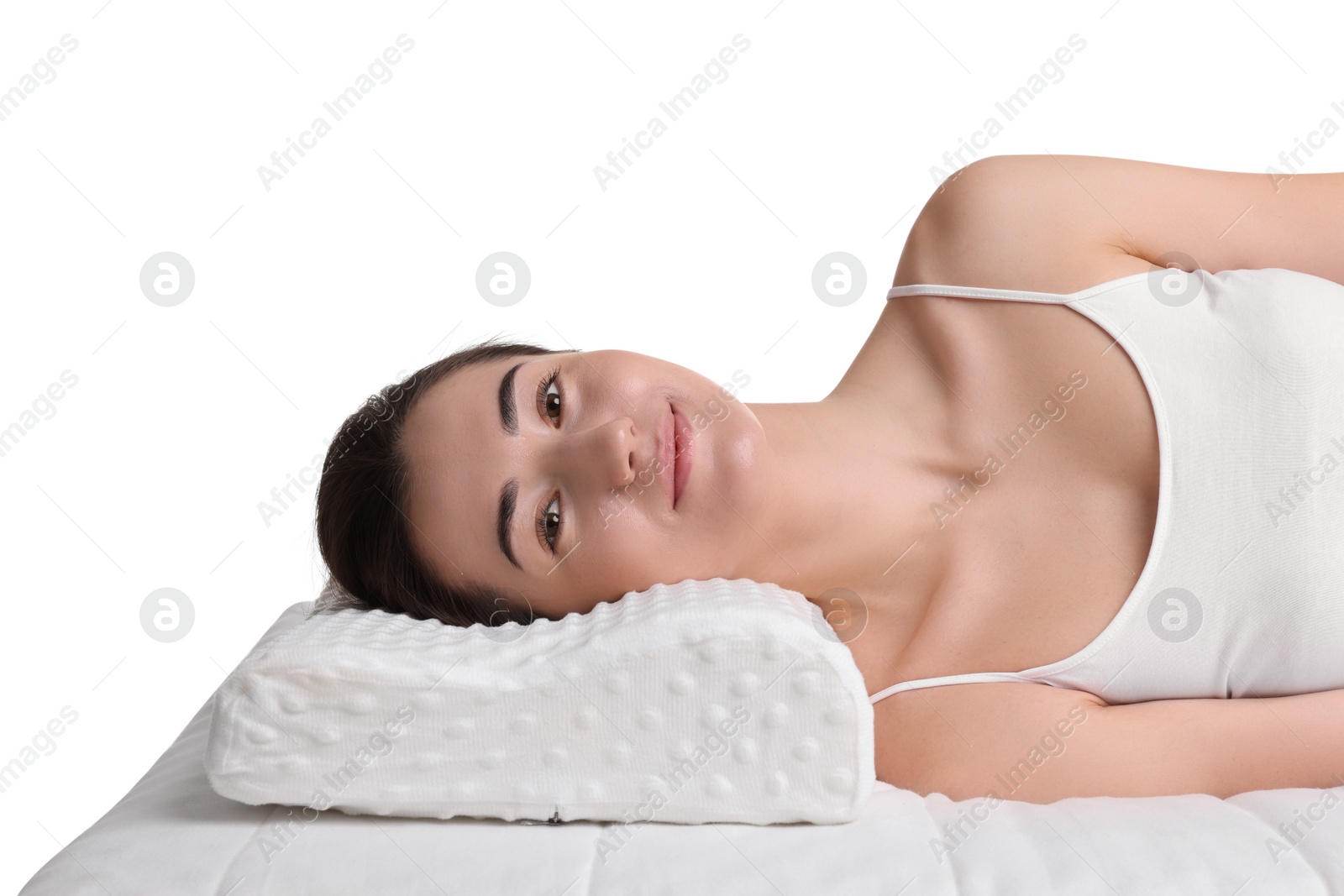 Photo of Woman lying on orthopedic pillow against white background