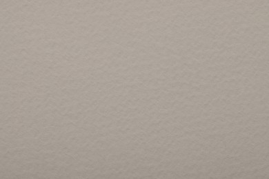 Texture of light grey paper sheet as background, top view