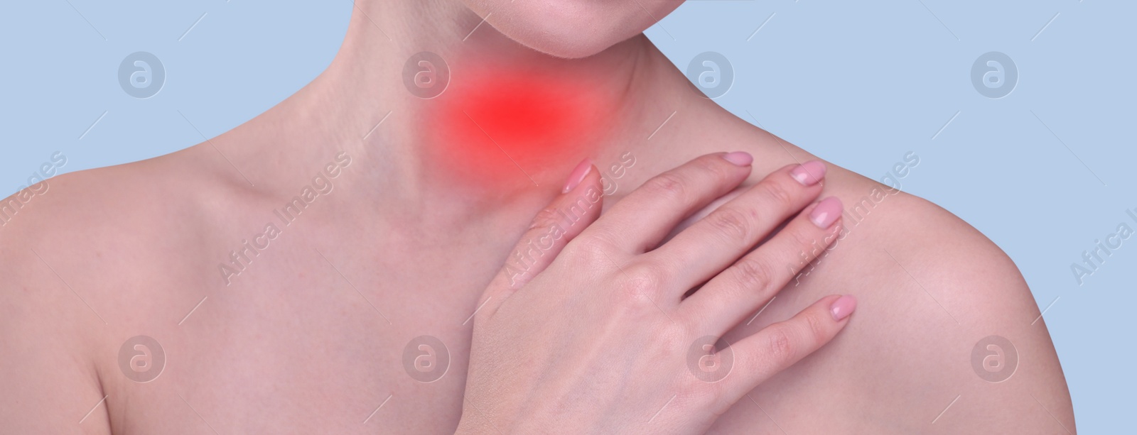 Image of Endocrine system. Woman suffering from pain in thyroid gland on light blue background, closeup. Banner design