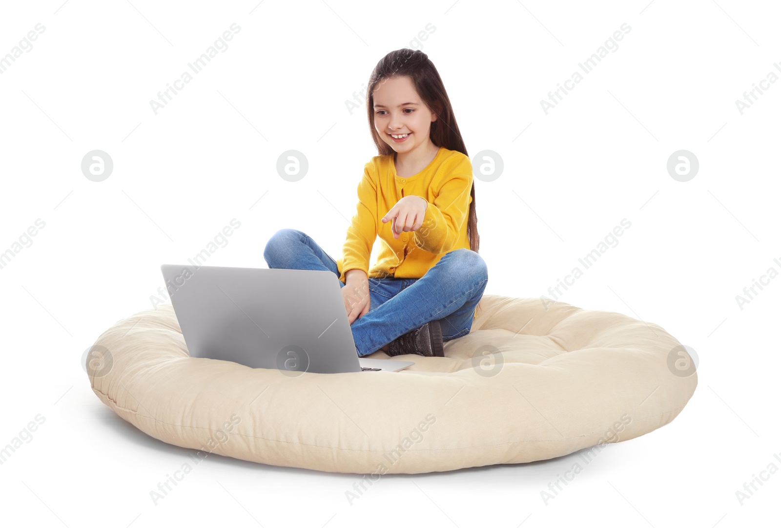 Photo of Little girl using video chat on laptop, white background