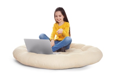 Little girl using video chat on laptop, white background