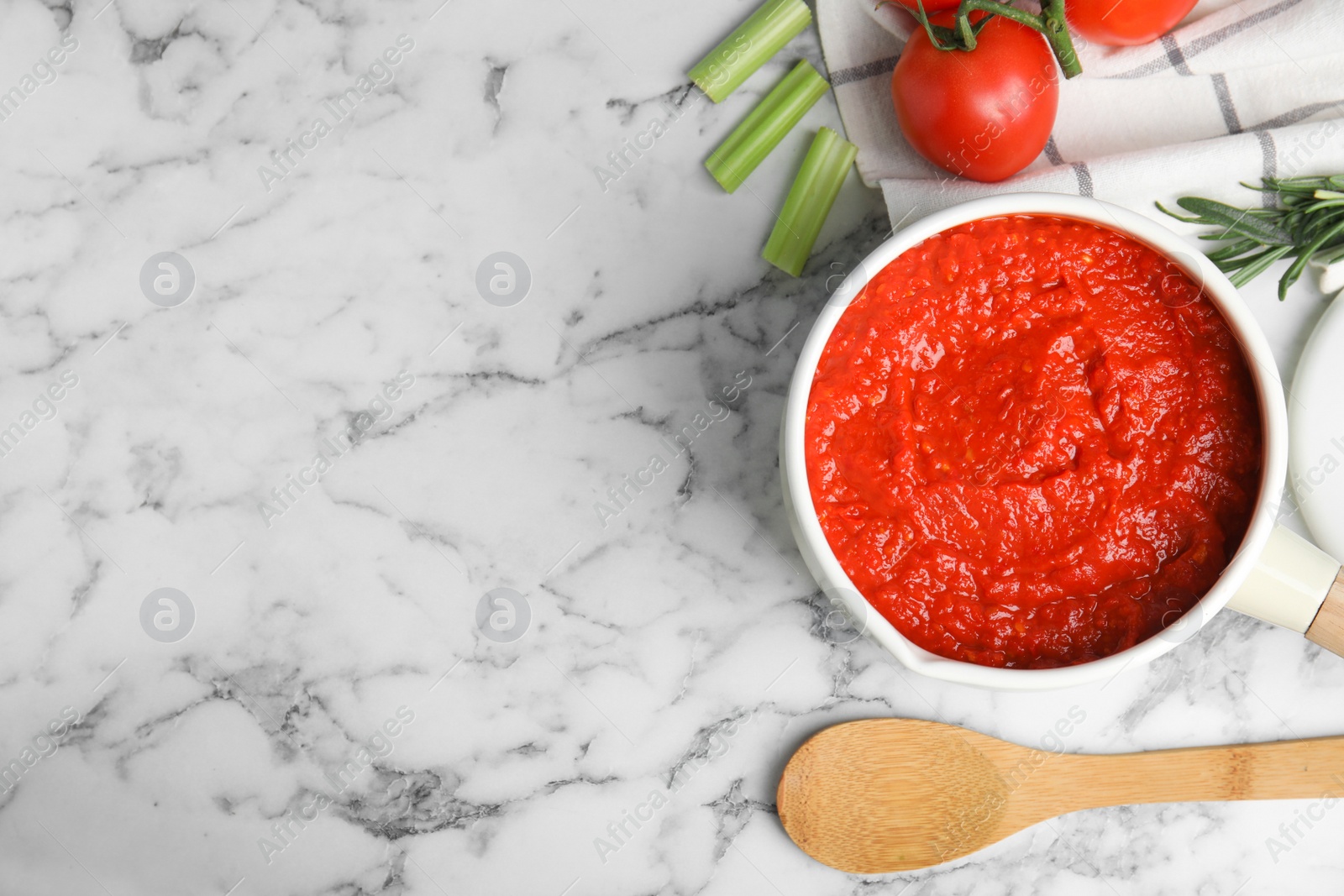 Photo of Flat lay composition with delicious tomato sauce on marble table. Space for text