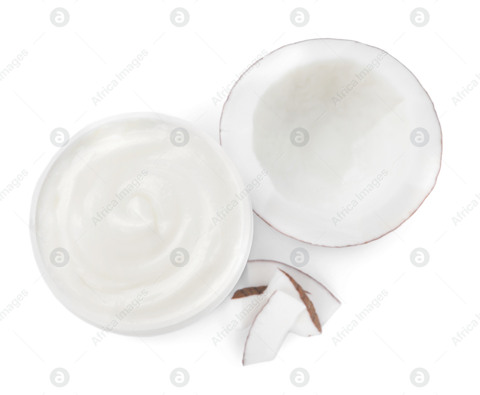 Photo of Jar of body cream with coconut on white background, top view