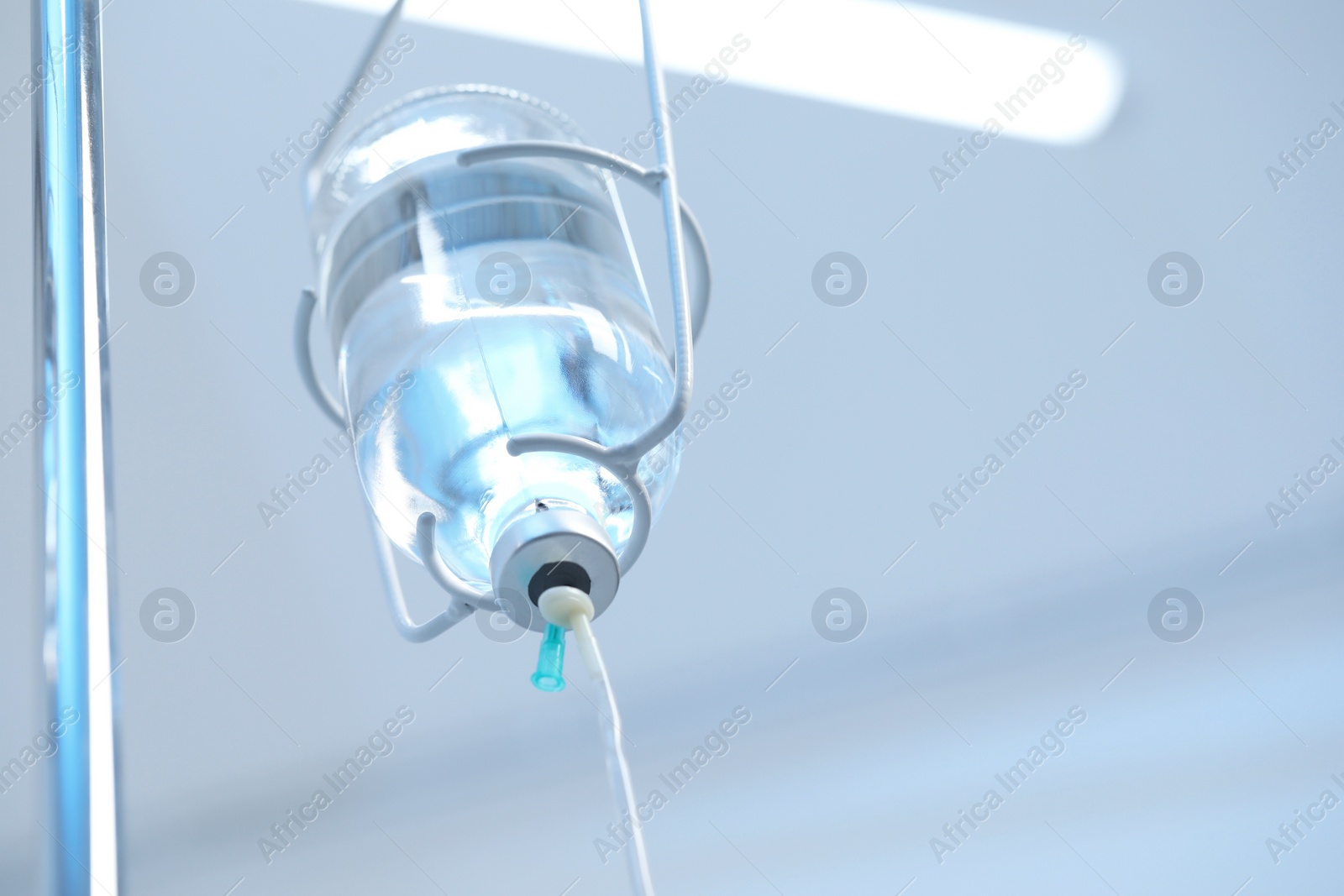 Photo of IV drip in hospital, low angle view. Space for text