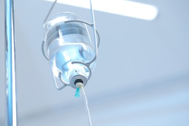 Photo of IV drip in hospital, low angle view. Space for text