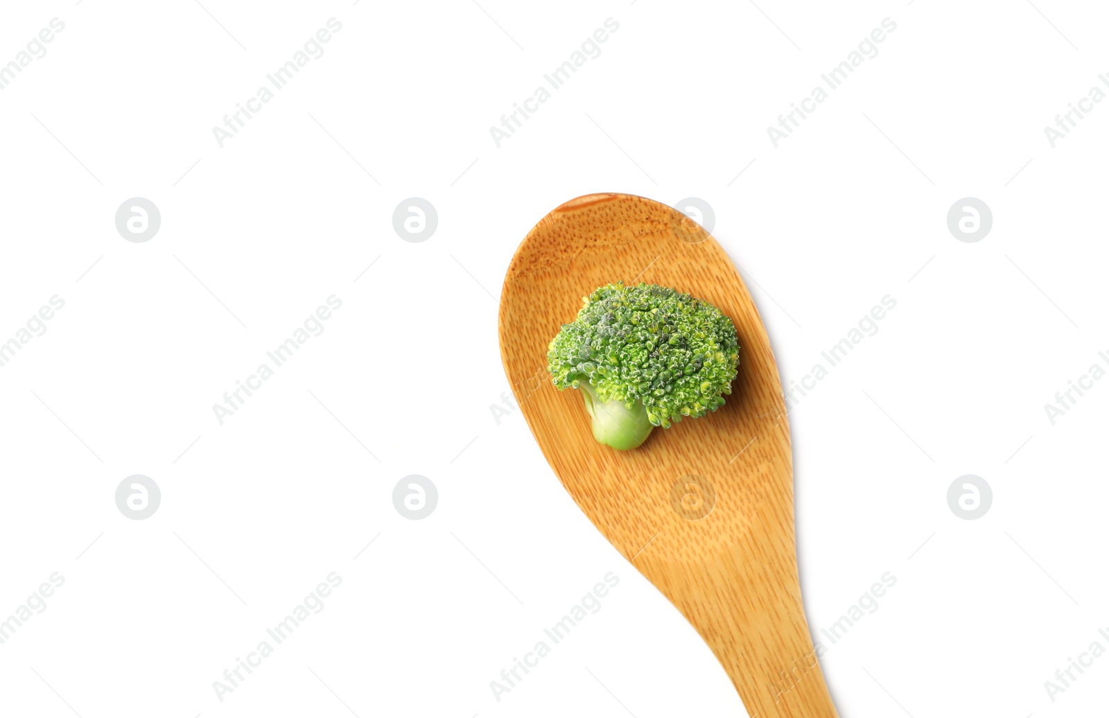 Photo of Spoon with fresh green broccoli on white background, top view