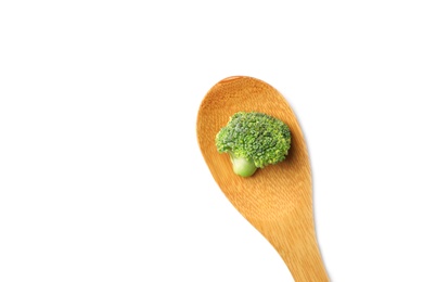 Photo of Spoon with fresh green broccoli on white background, top view