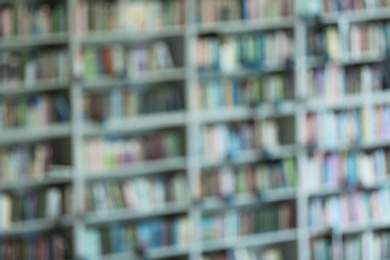 Photo of Blurred view of shelves with books in library