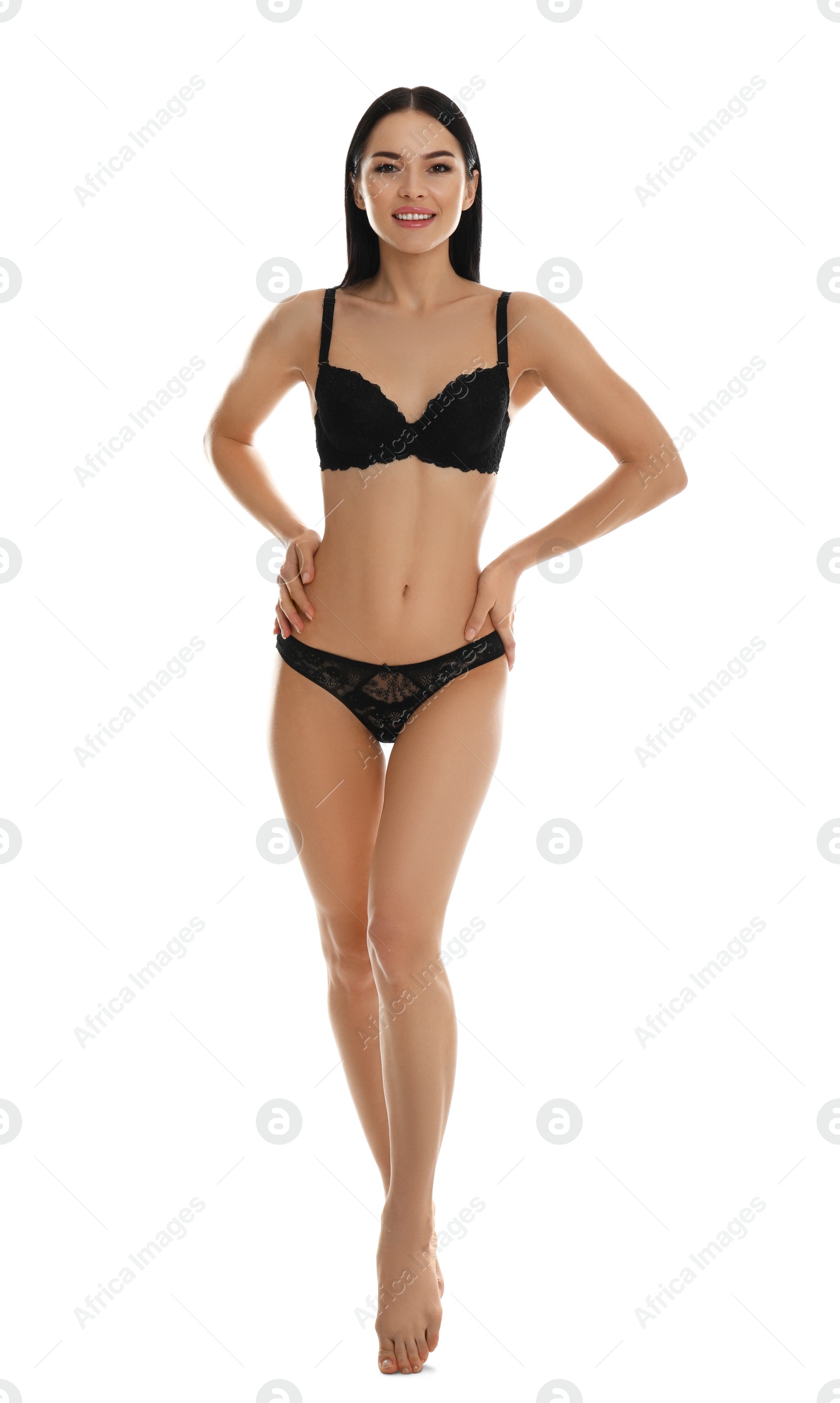 Photo of Beautiful young woman in black underwear isolated on white