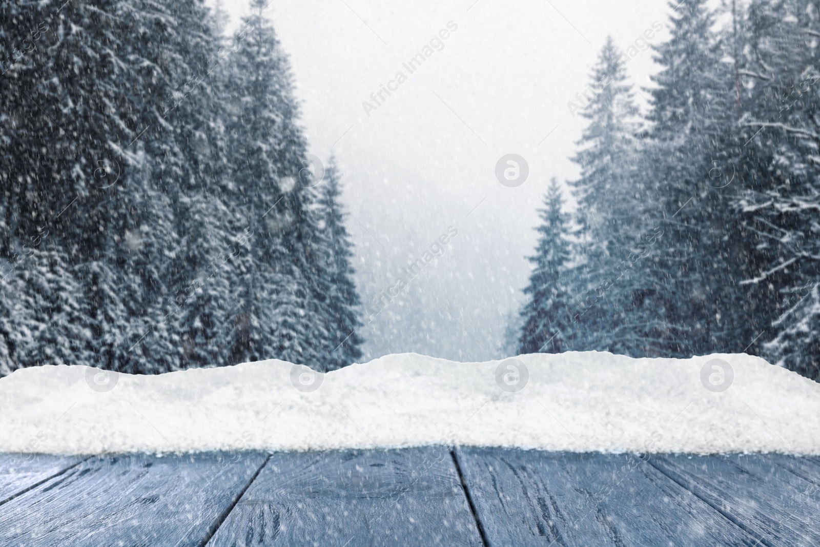 Image of Wooden surface and beautiful view of winter landscape 