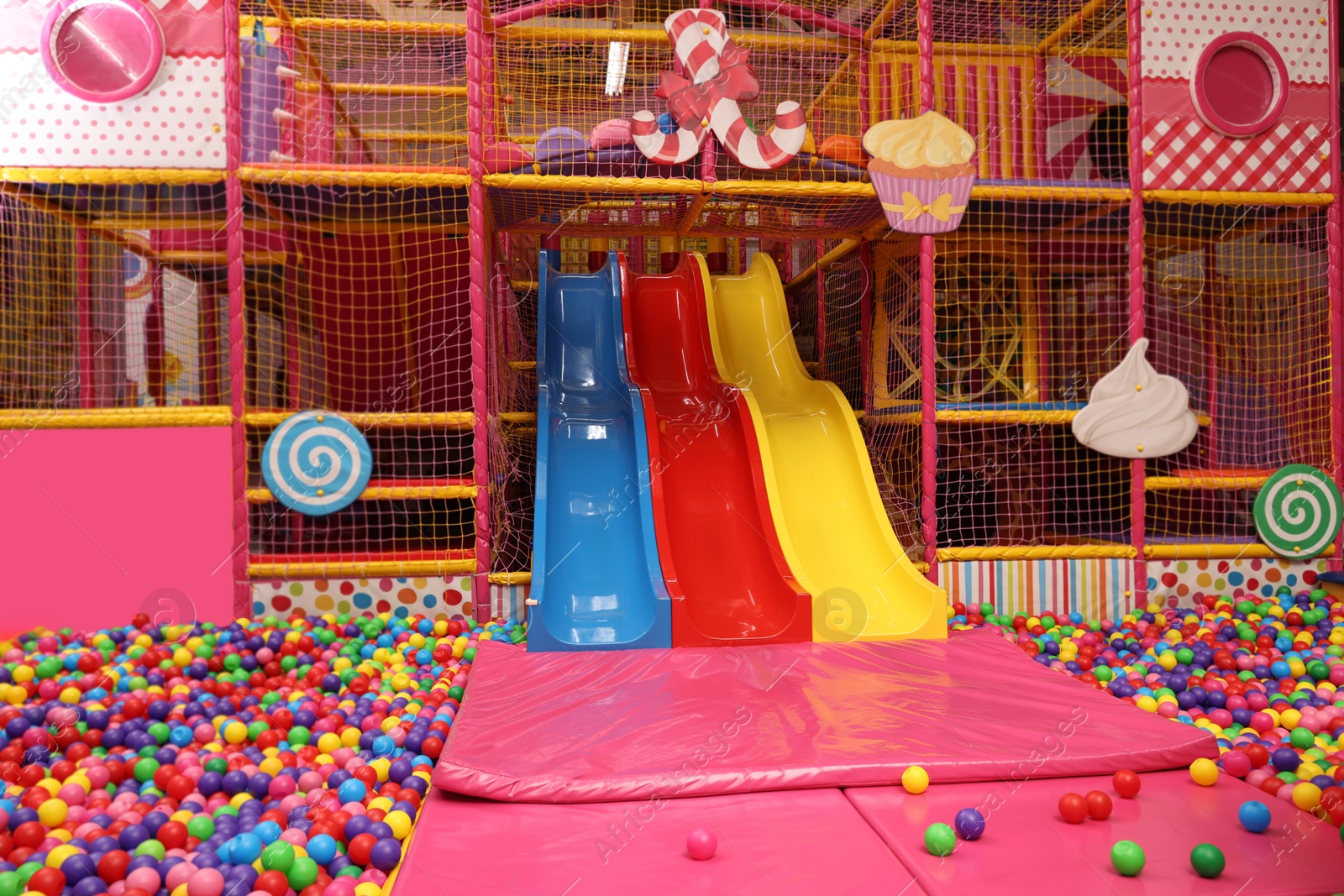 Photo of Slides and many colorful balls in ball pit