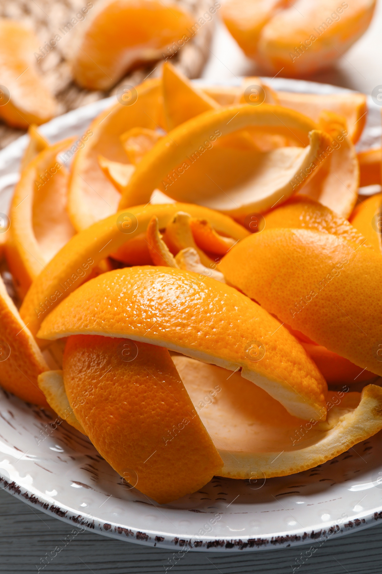 Photo of Orange peels preparing for drying on white wooden table, closeup