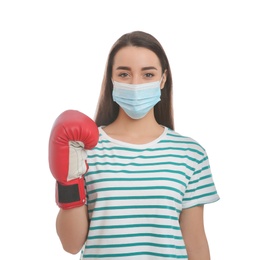 Photo of Woman with protective mask and boxing gloves on white background. Strong immunity concept