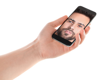 Image of Man using smartphone with facial recognition system on white background, closeup. Biometric verification