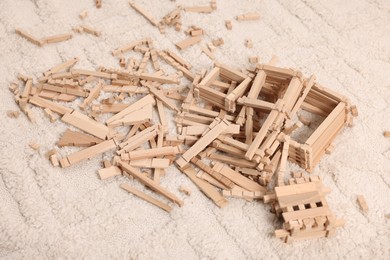 Wooden construction set on carpet indoors. Children's toy