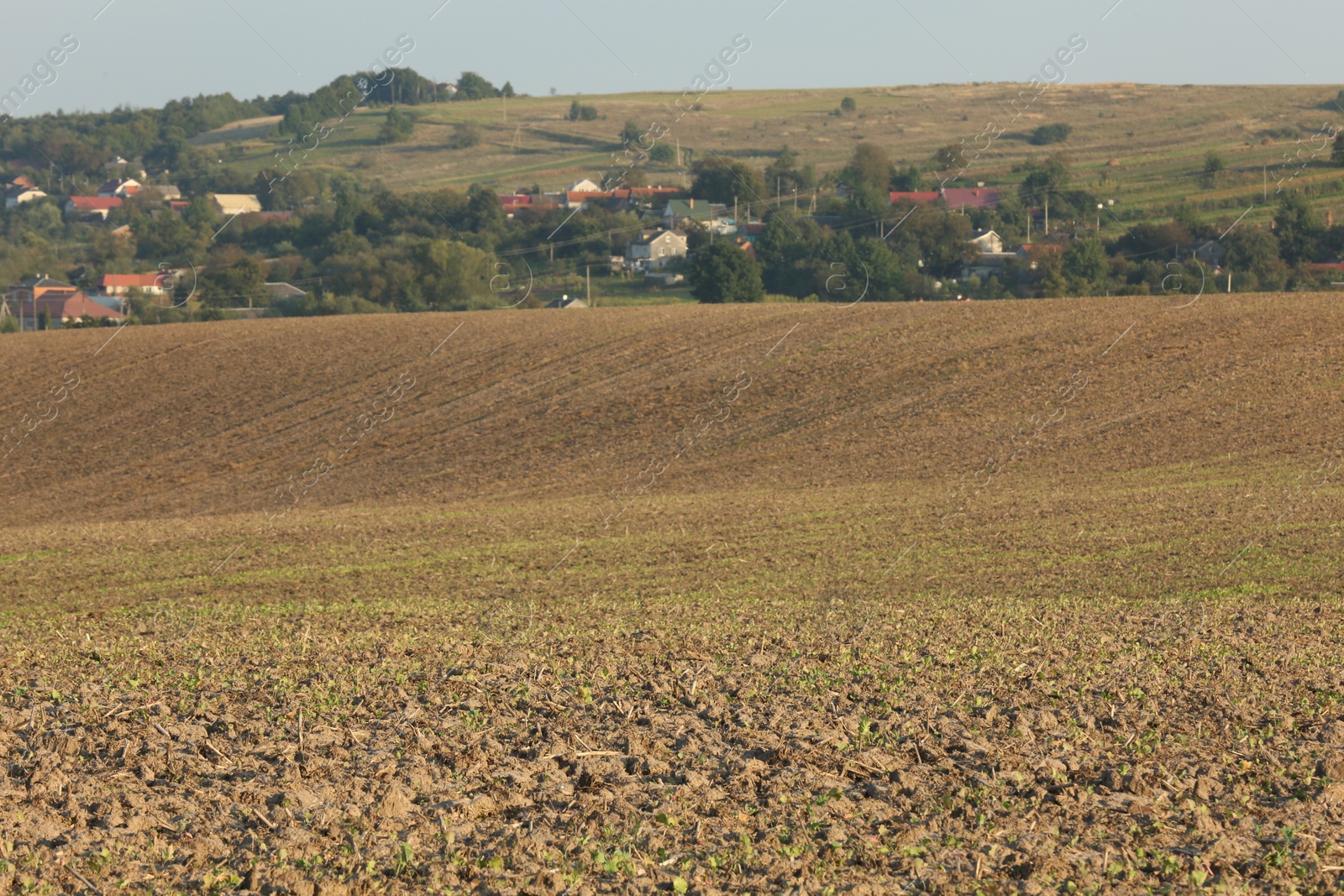 Photo of Beautiful view of agricultural field near village outdoors