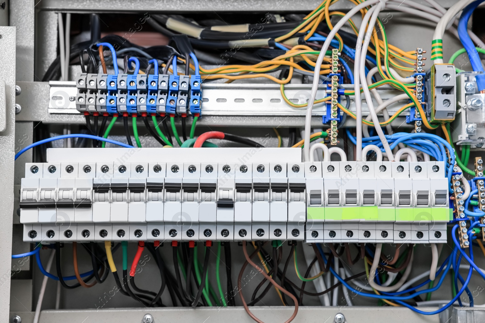 Photo of Electrical panel with many wires in fuse box, closeup