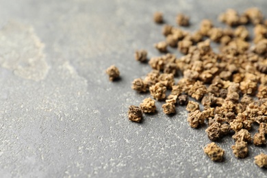 Photo of Raw beet seeds and space for text on grey background, closeup. Vegetable planting