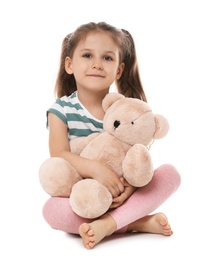 Photo of Portrait of cute little girl with teddy bear on white background