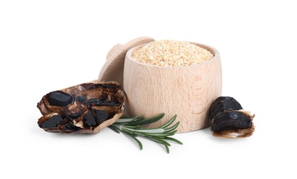 Photo of Dehydrated garlic granules, fermented black garlic and rosemary isolated on white