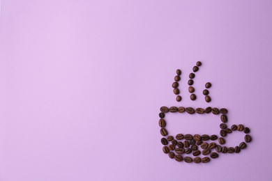 Cup made of coffee beans on lilac background, flat lay. Space for text