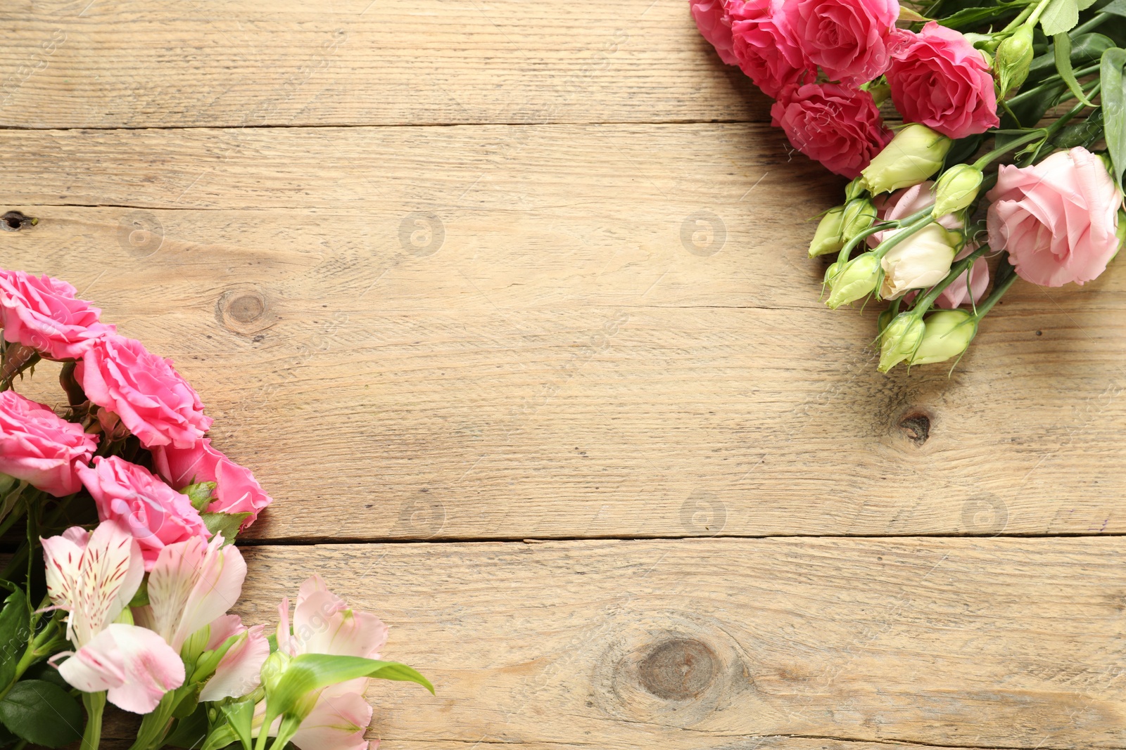 Photo of Happy Mother's Day. Beautiful flowers on wooden table, flat lay. Space for text