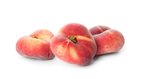 Photo of Fresh ripe donut peaches on white background