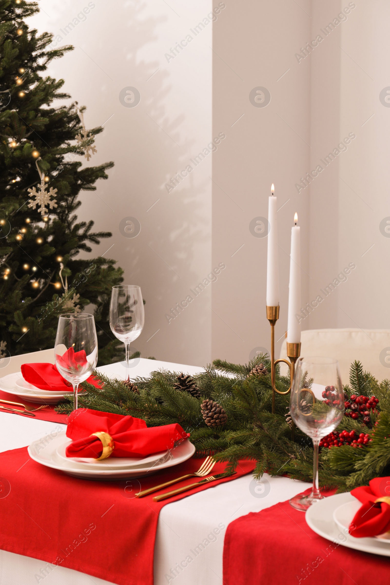 Photo of Beautiful table setting with Christmas decor indoors