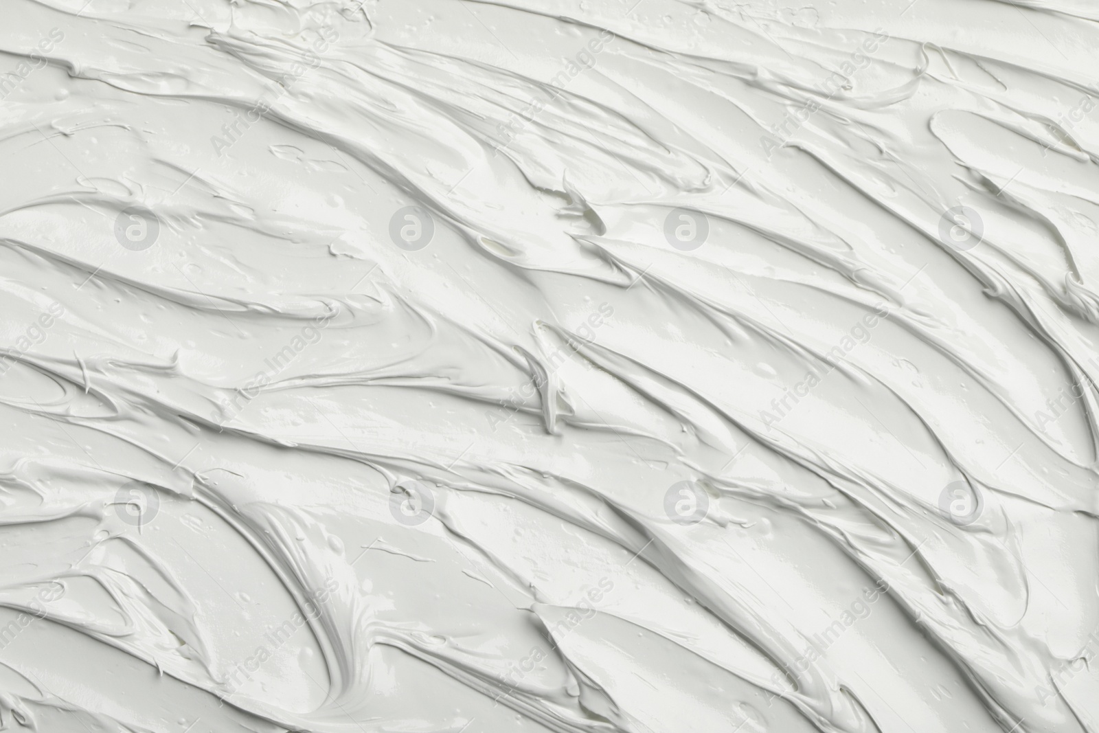 Photo of Texture of white oil paint as background, closeup