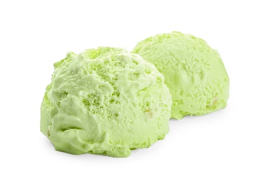 Photo of Scoops of delicious pistachio ice cream on white background