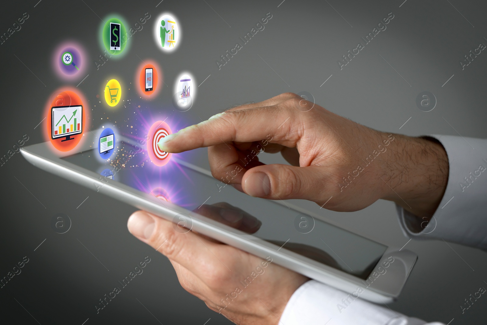 Image of Marketing. Man touching virtual icon over tablet against grey background, closeup