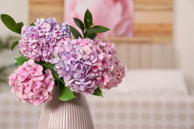 Photo of Bouquet of beautiful hydrangea flowers indoors, closeup. Interior design