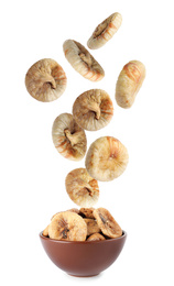 Image of Dried fig fruits falling into bowl on white background